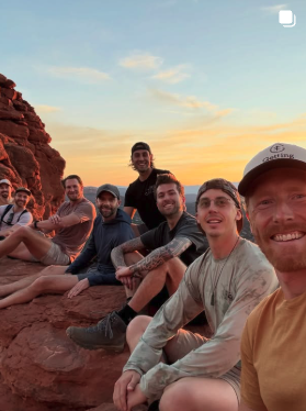 Men's group at sunset on the red rocks